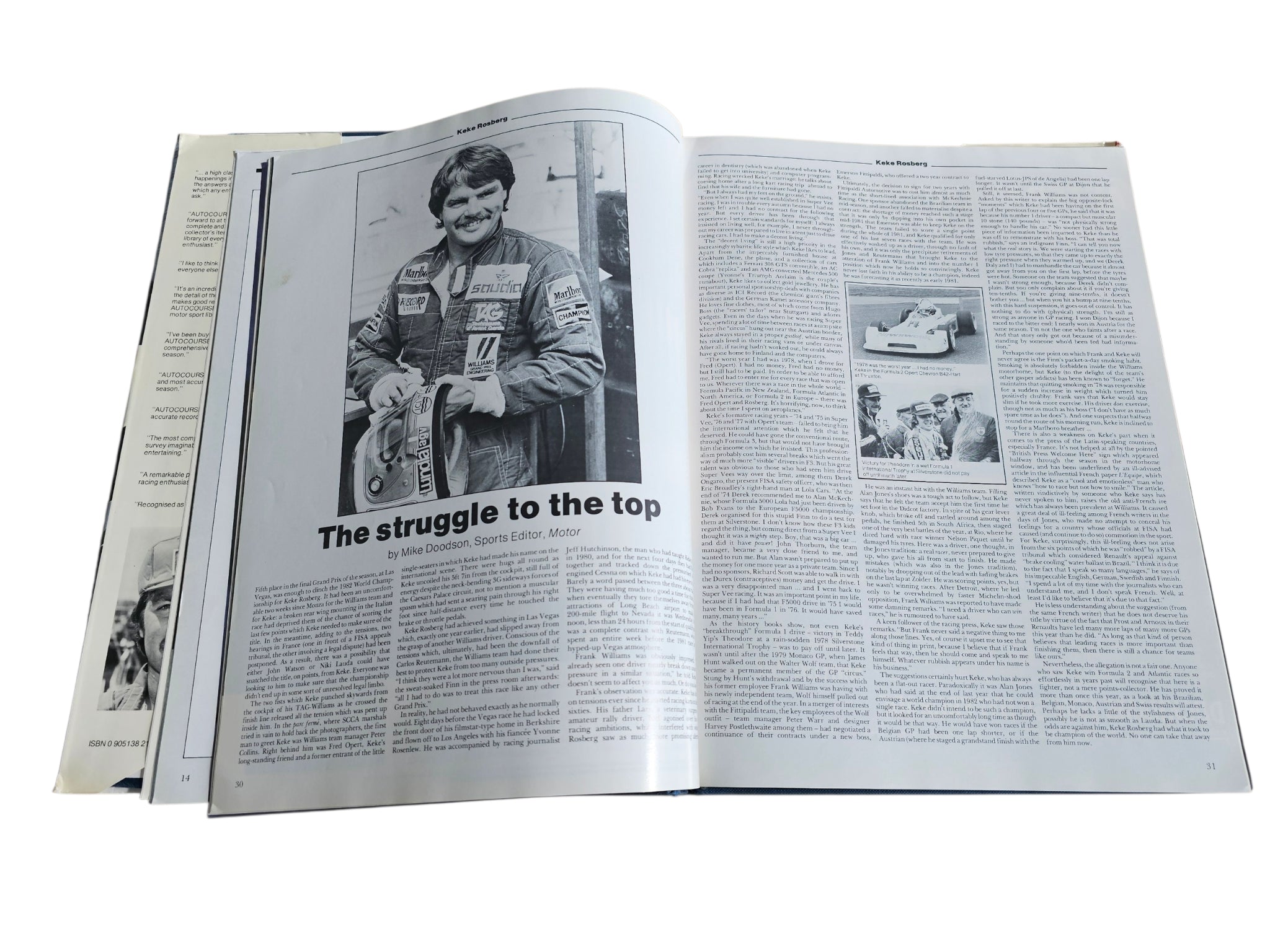 Open racing book pages with black-and-white photos and dense article text