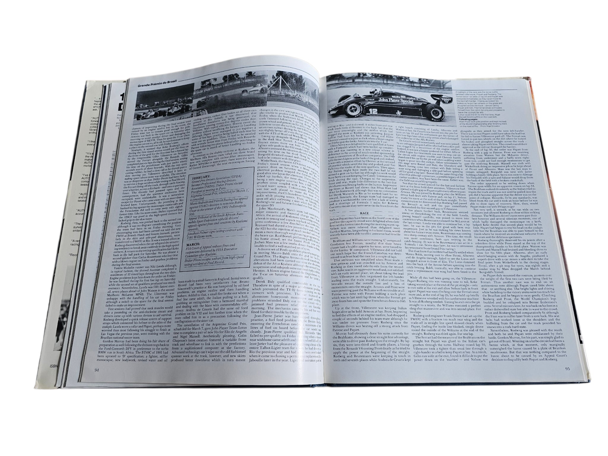 Open racing book pages with black-and-white article text and small photos