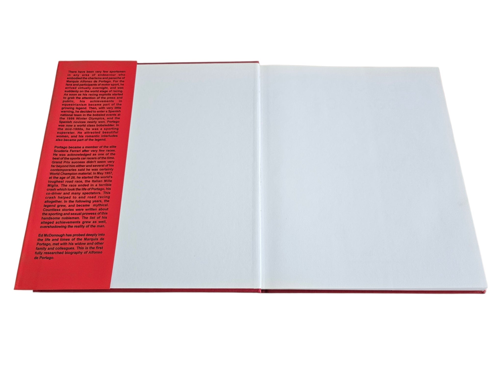 Open book spread with red page edges and mostly blank white pages