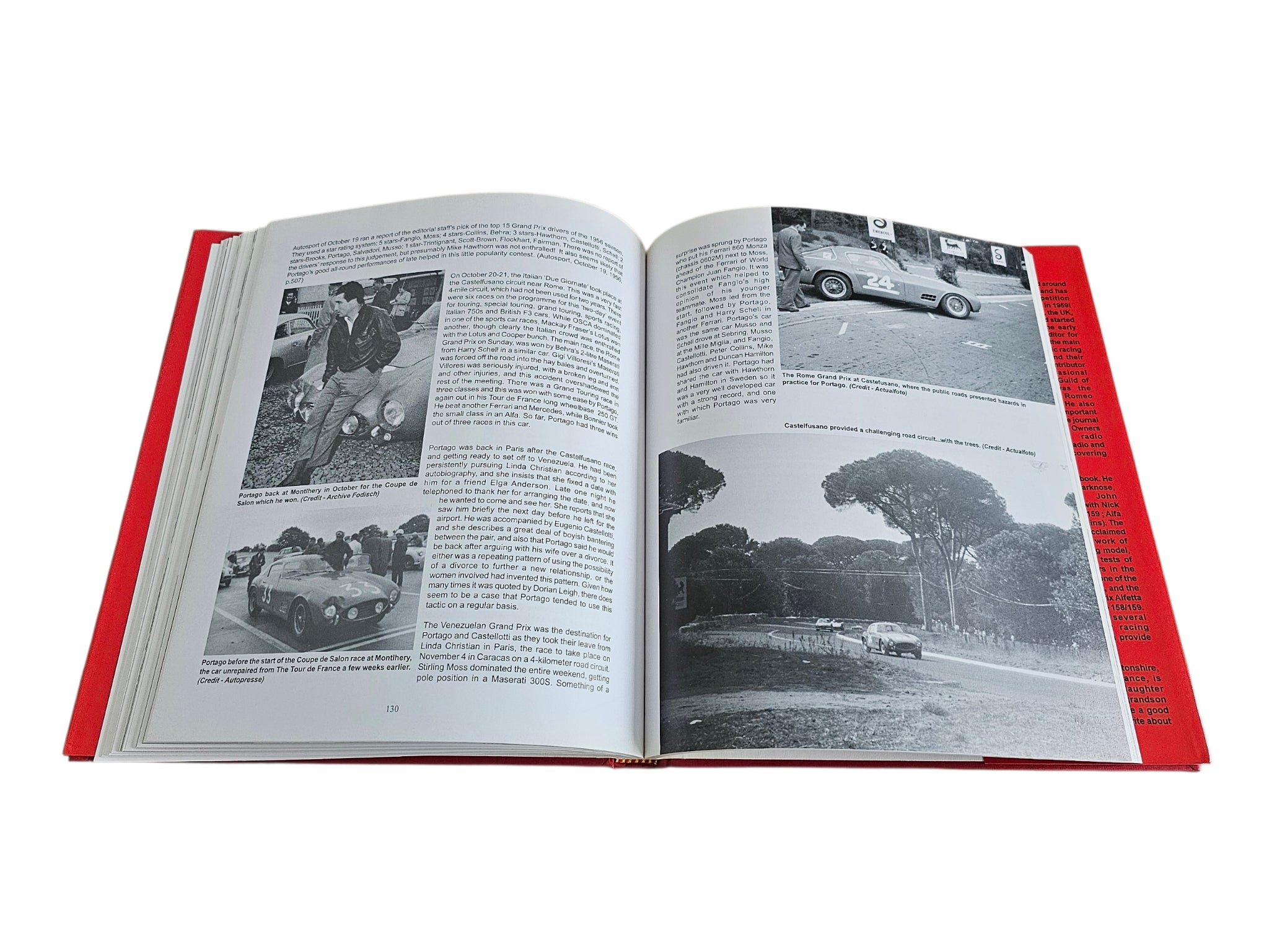 Signed hardcover book opened to photo pages with car images; red page edges