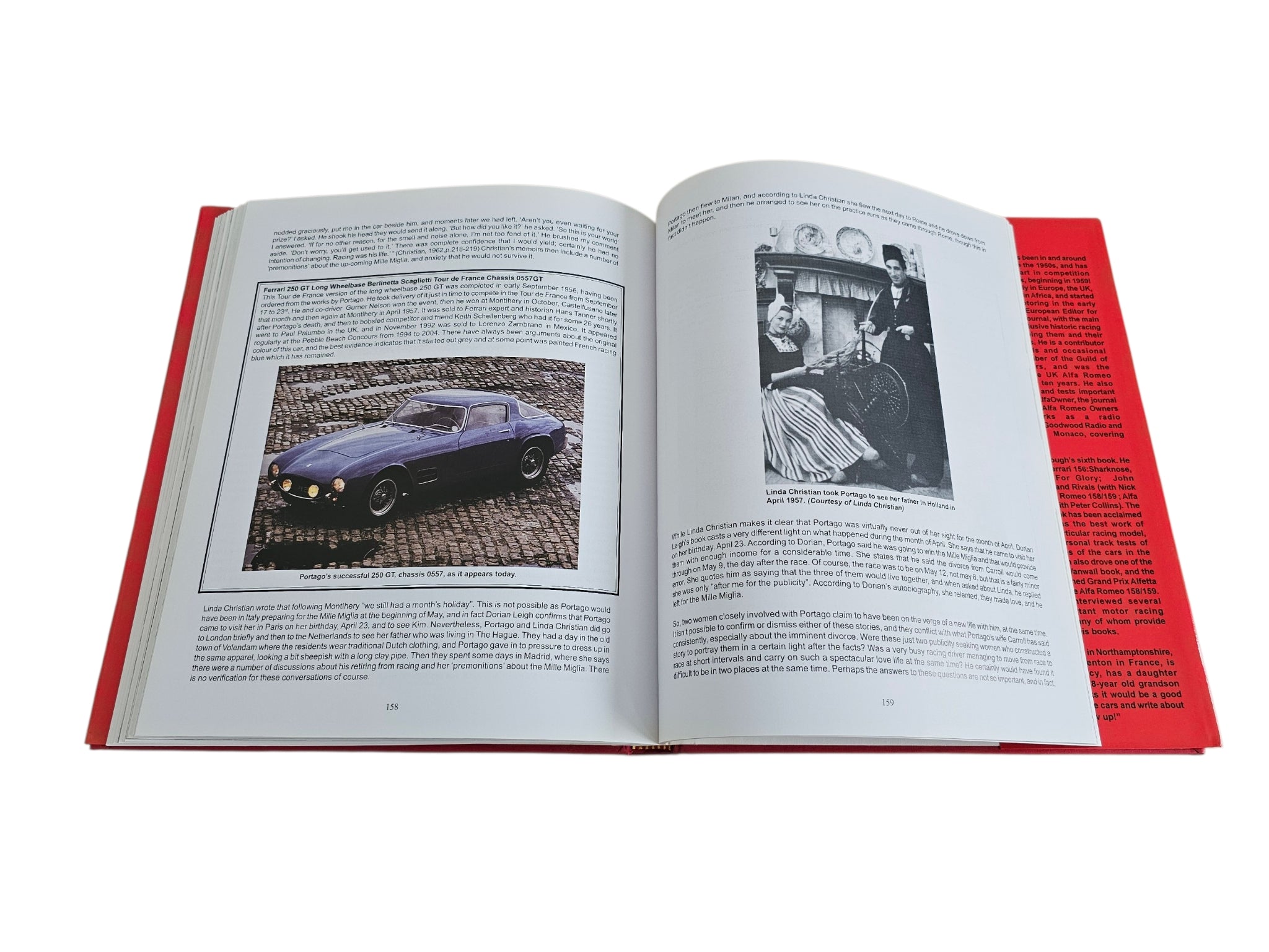 Signed hardcover book opened to photo and text pages; car image and red side
