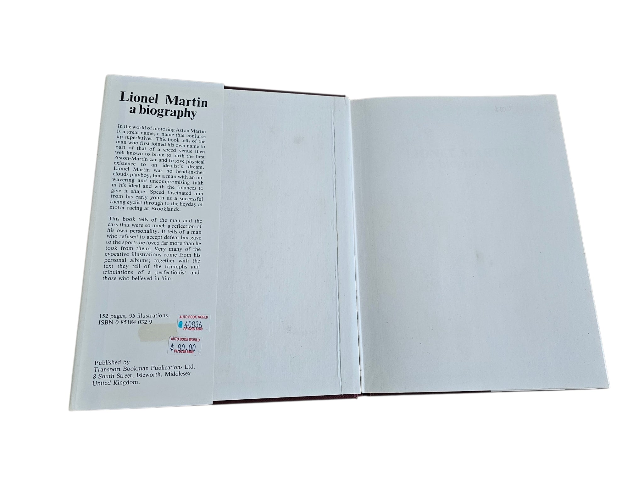 Hardcover biography book open, text on left page and blank right pages