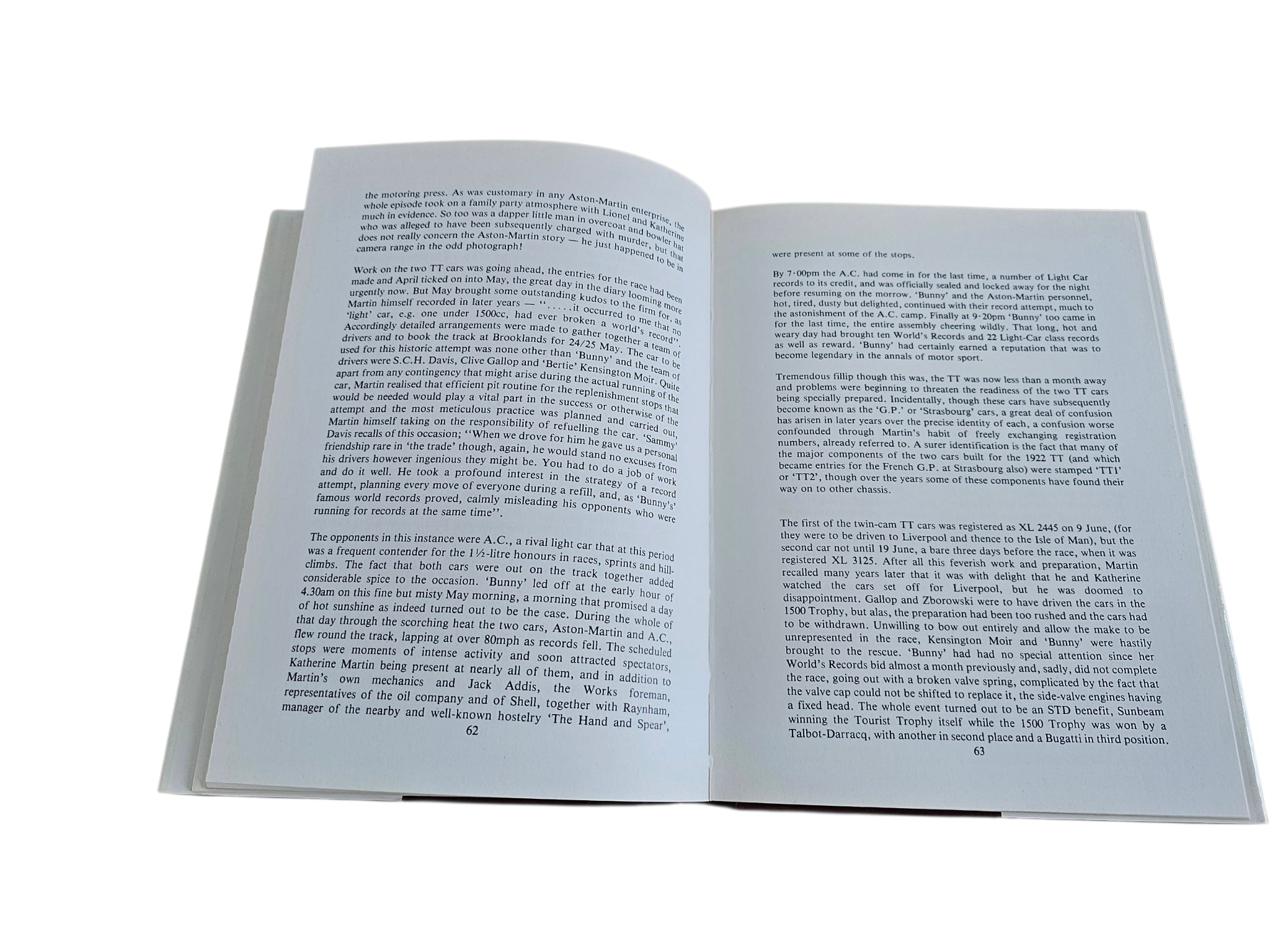 Hardcover biography book open to dense text pages with two columns