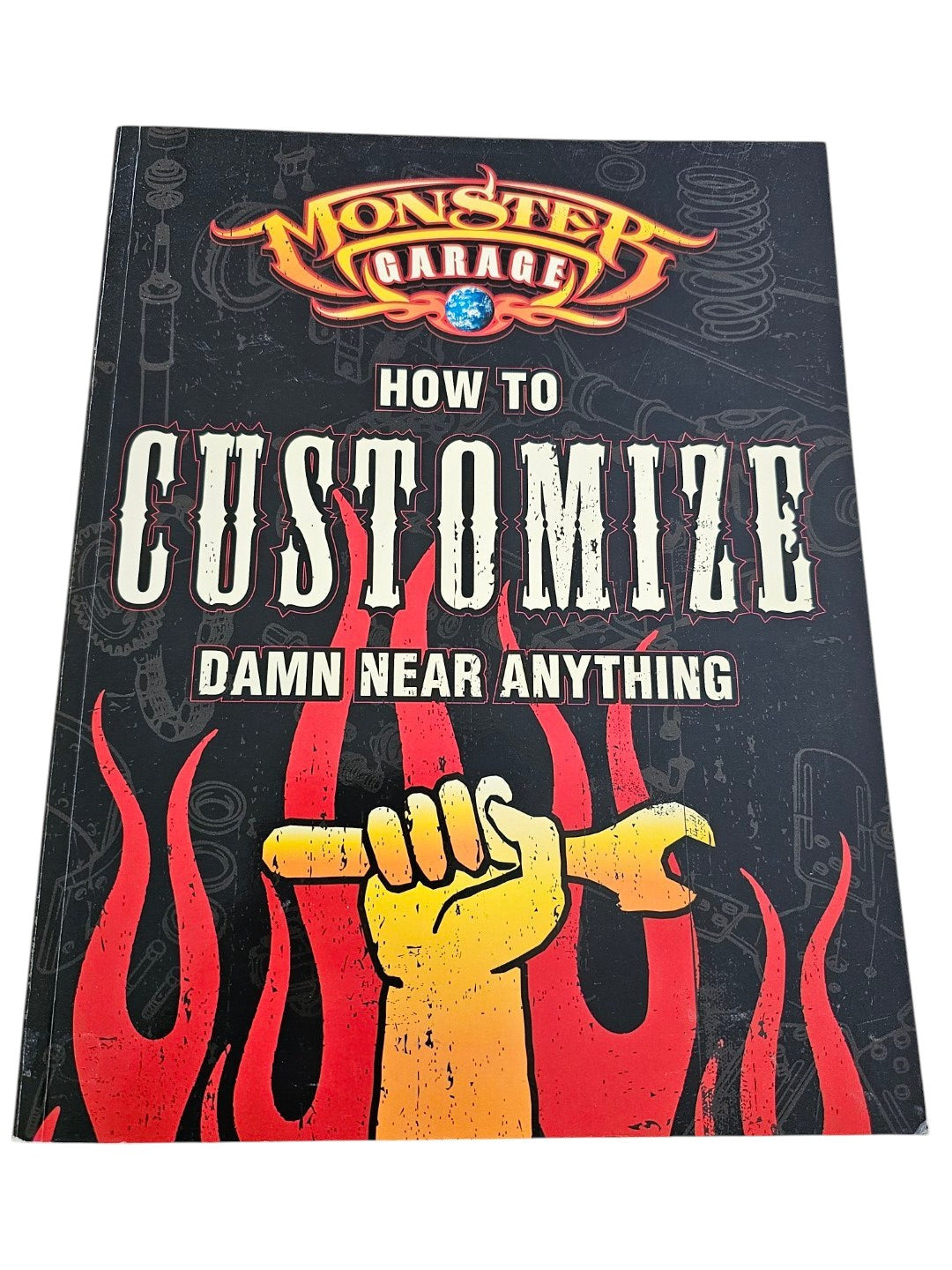 Book cover with text 'How to Customize Damn Near Anything' and a graphic of a hand with a wrench on a wooden surface.