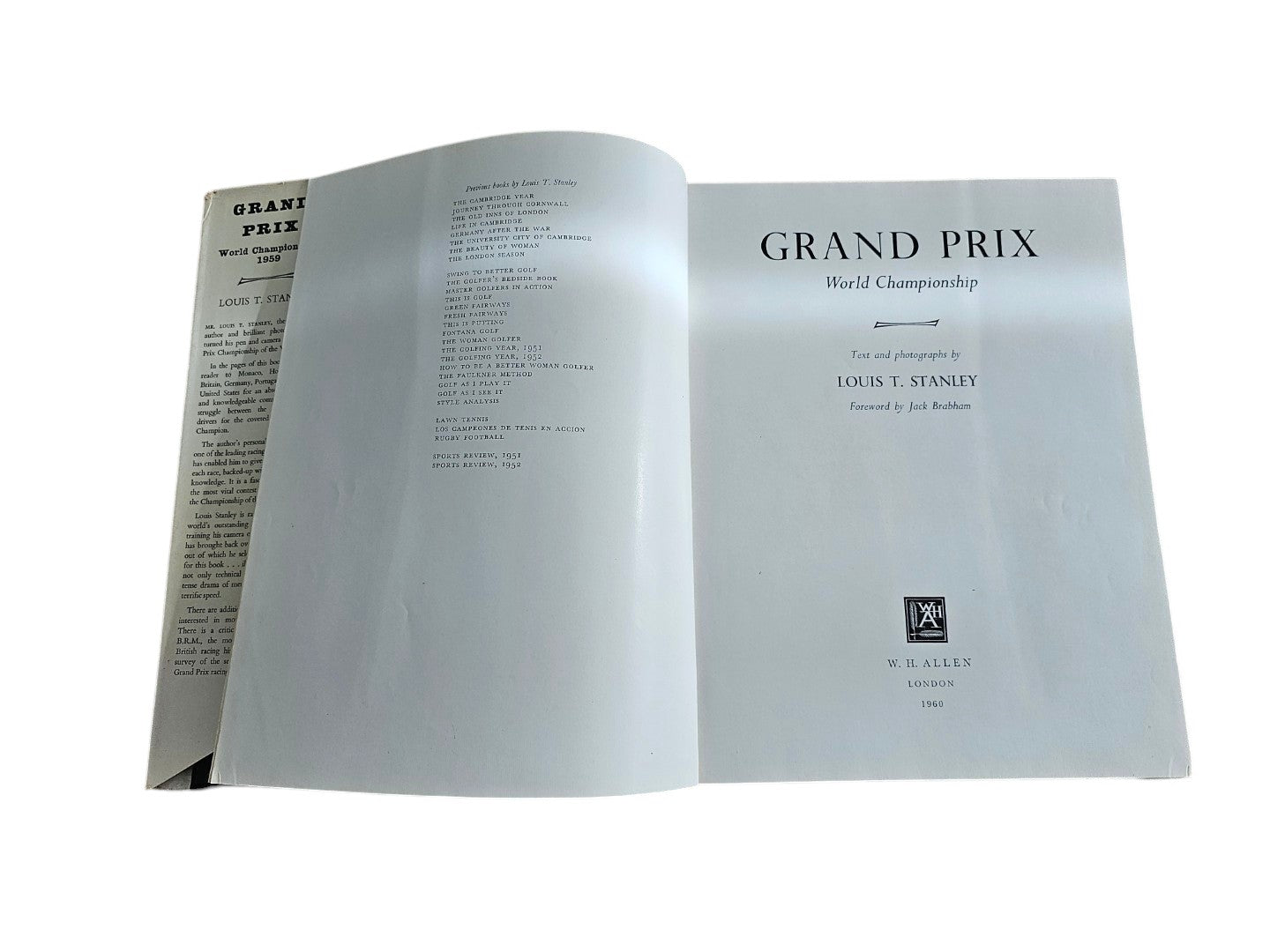 Vintage auto racing book open to title pages with “Grand Prix World Championship” and Louis T. Stanley.