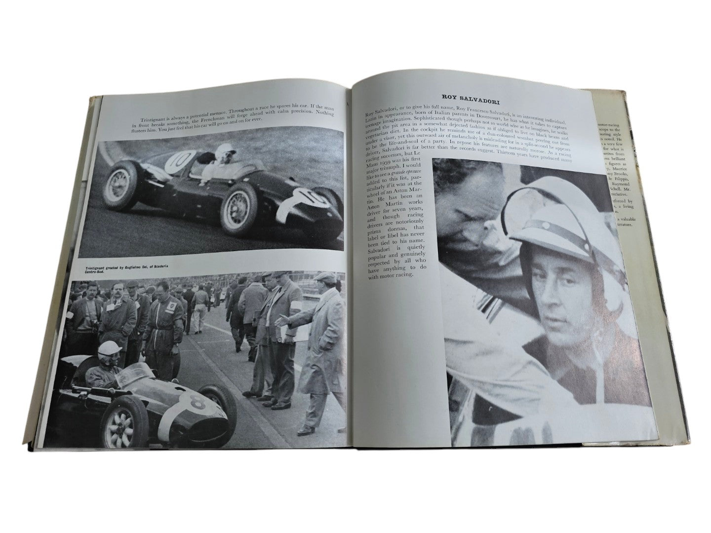Open auto racing book spread with photos of cars, crowds, and a helmeted driver