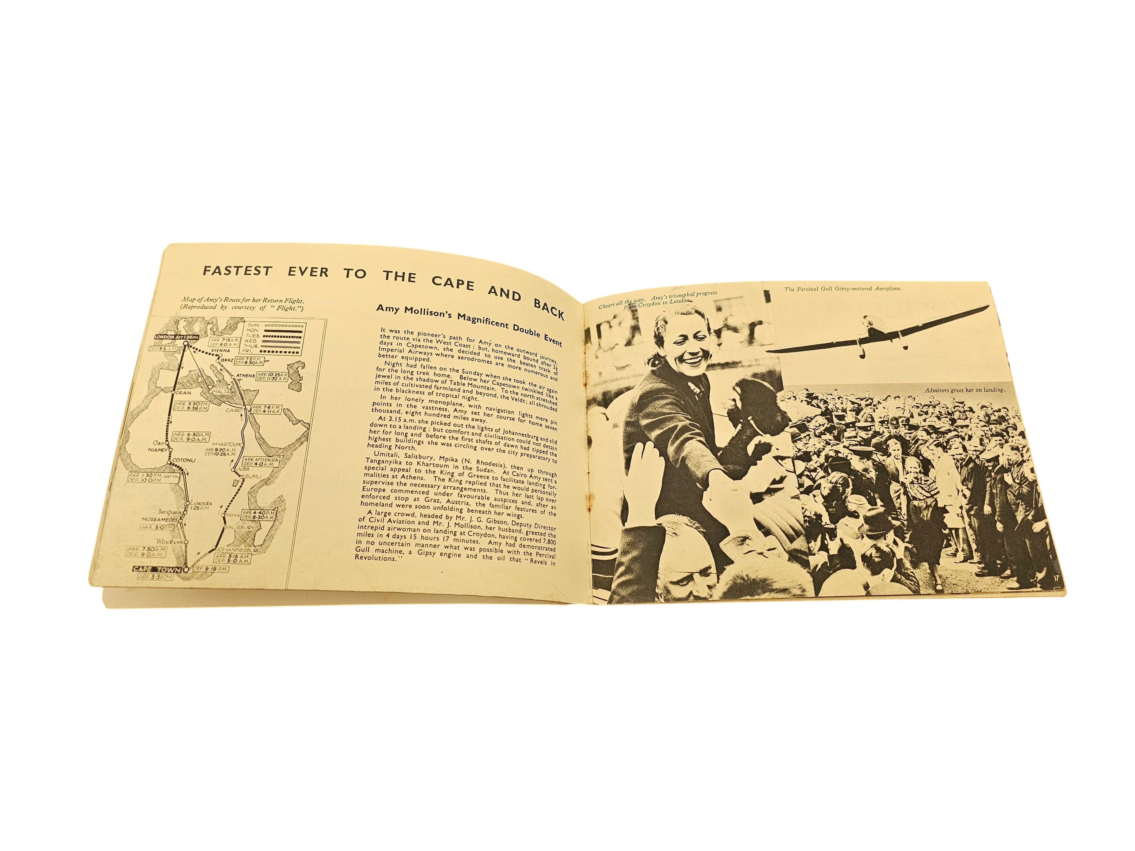 Open vintage booklet pages with route map and crowd scene photos