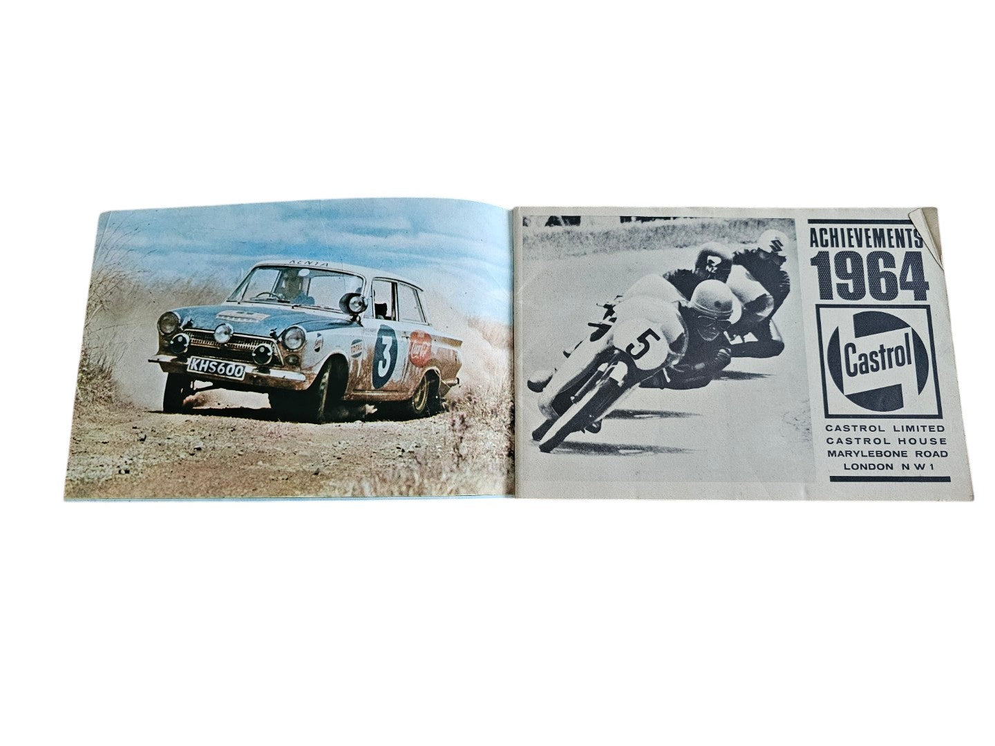 Open vintage booklet featuring split race photos of cars and a motorcycle image