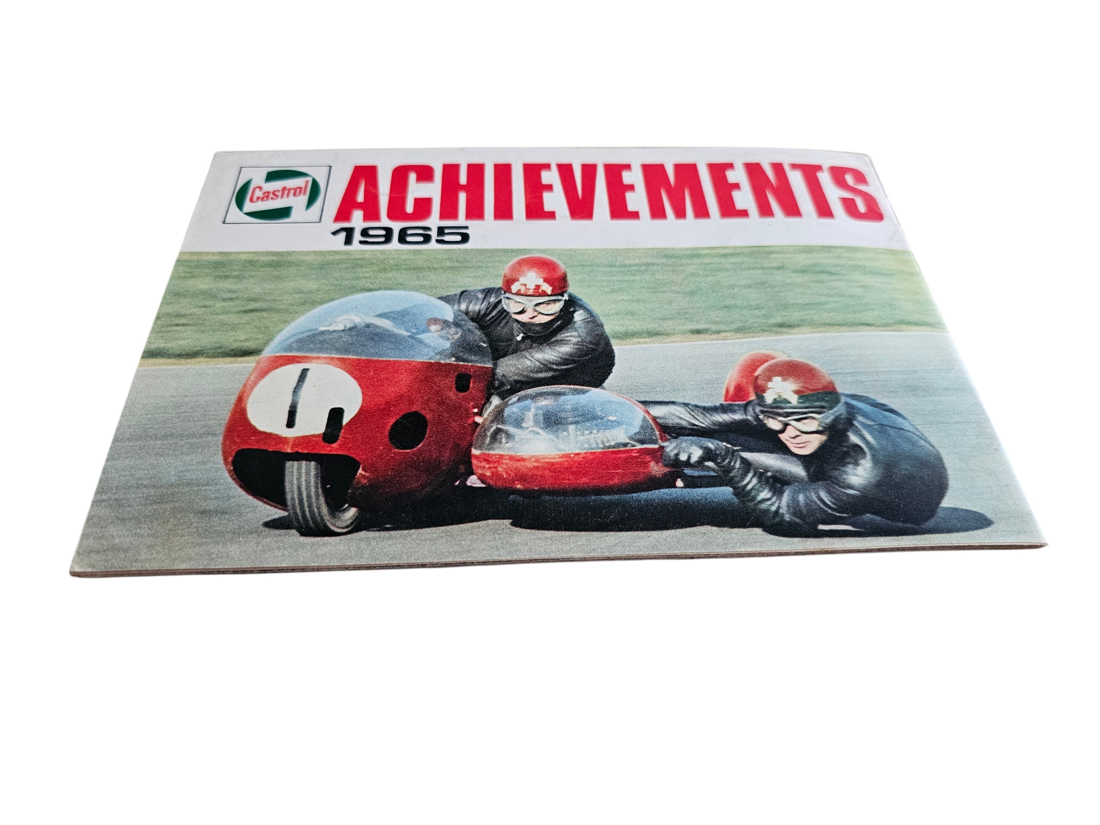Vintage racing magazine cover with red 1965 title and red race car with two drivers
