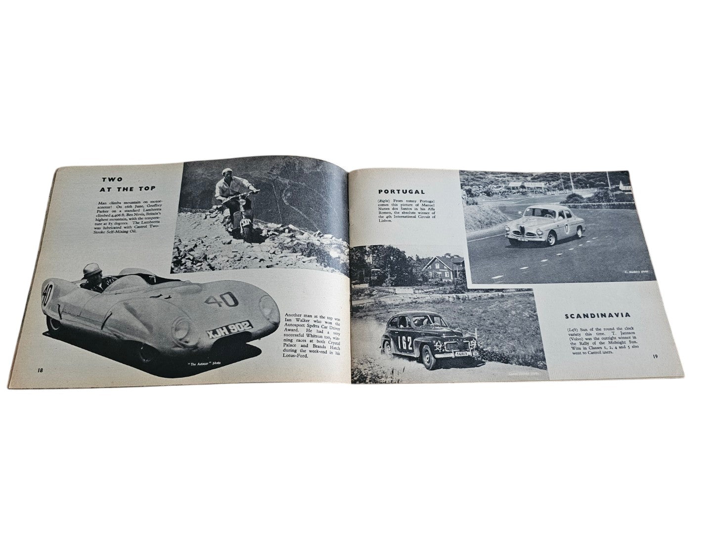 Open vintage racing book spread with grayscale race car images and map photos