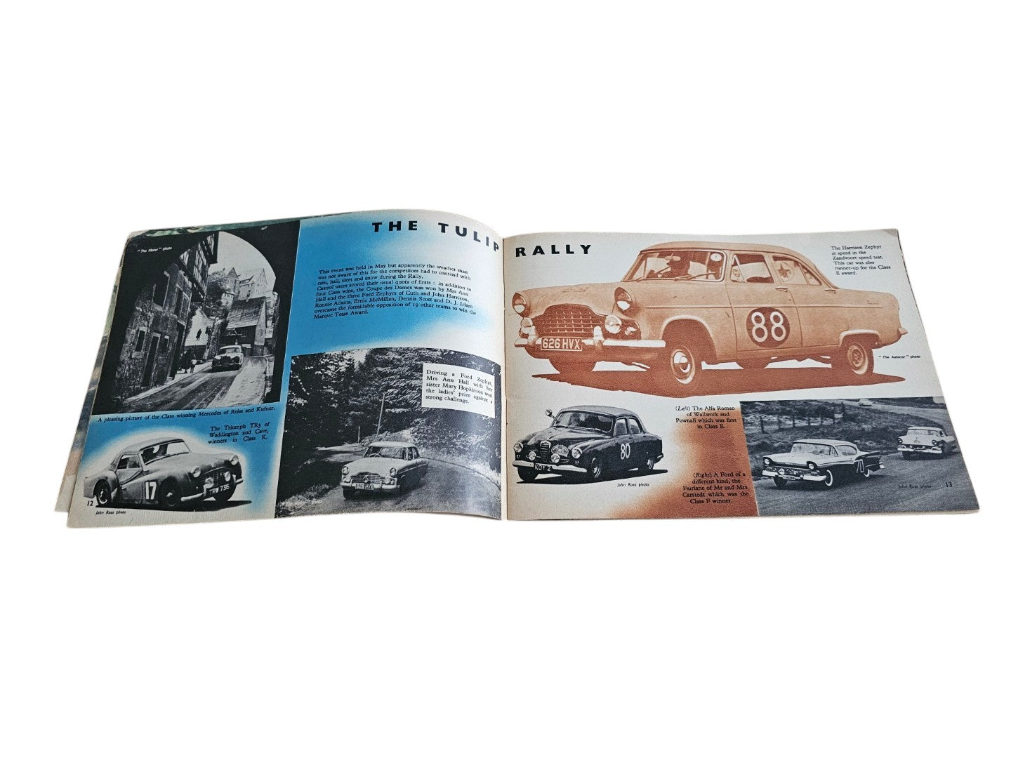 Open vintage racing book spread with car photos and a red car diagram