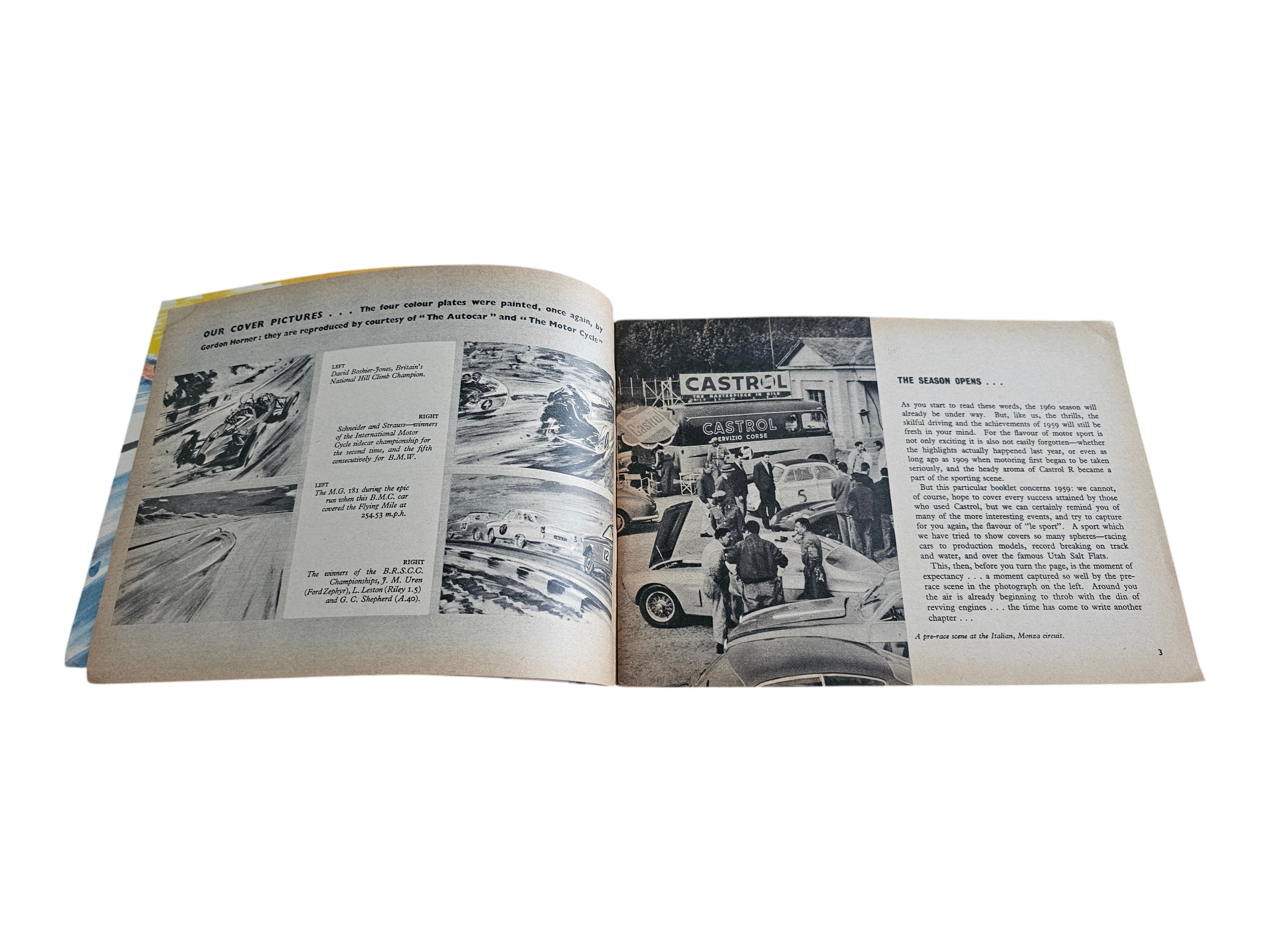 Open vintage racing book with black-and-white photos and paragraphs on two pages