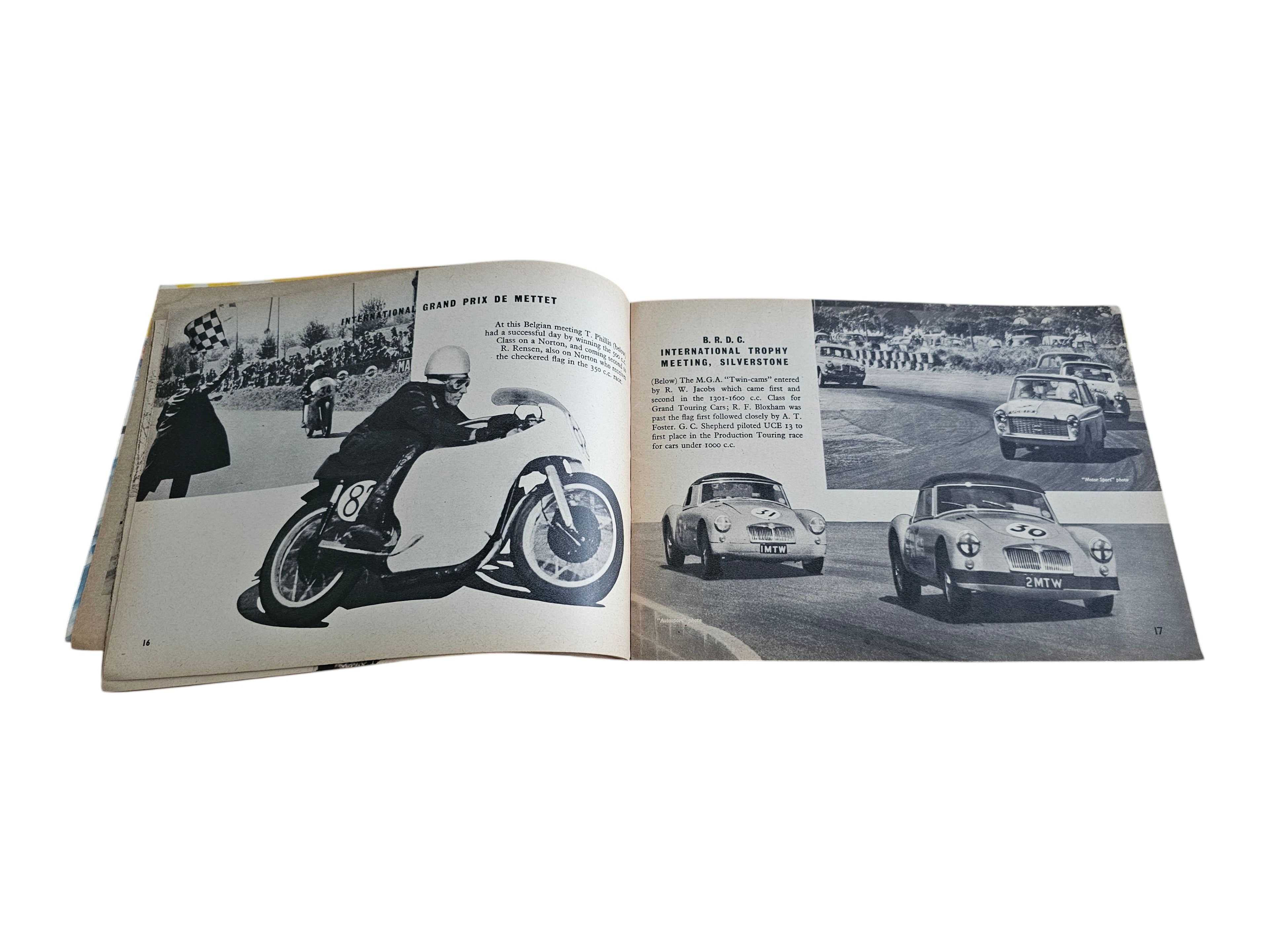 Open vintage racing book with black-and-white motorcycle race and crowd shots