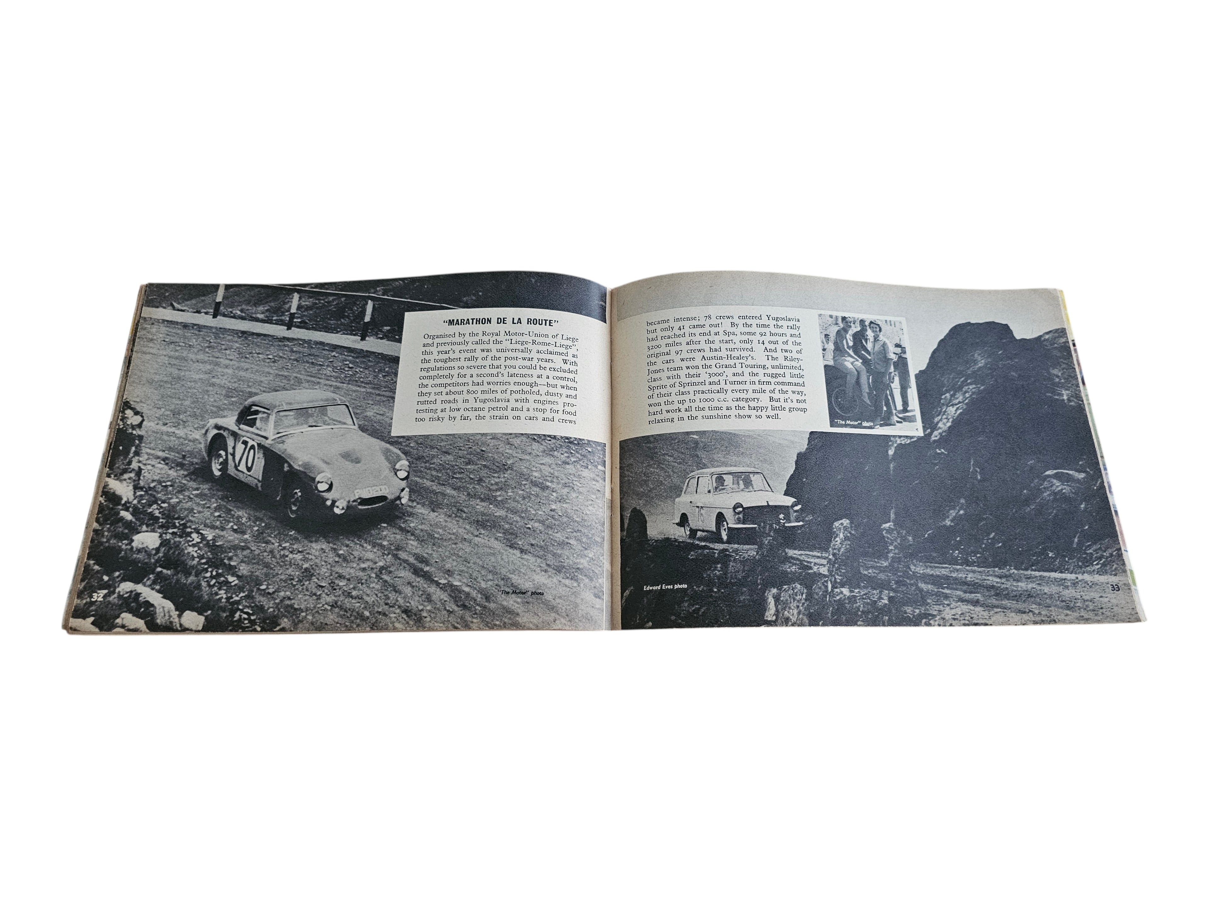 Open vintage racing book with black-and-white car racing photos on two pages