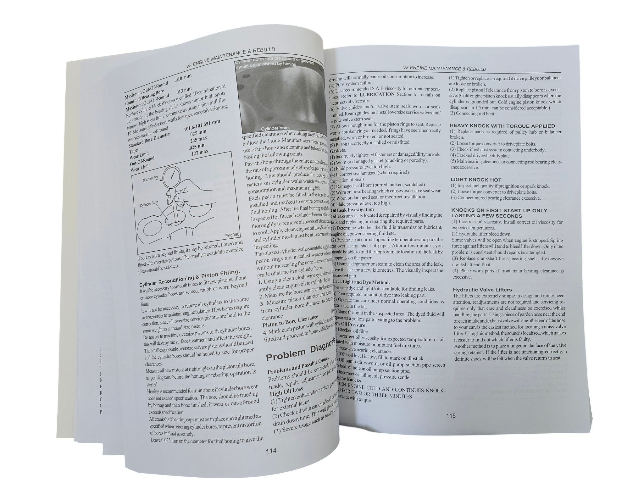 Workshop manual open troubleshooting pages with diagrams and text