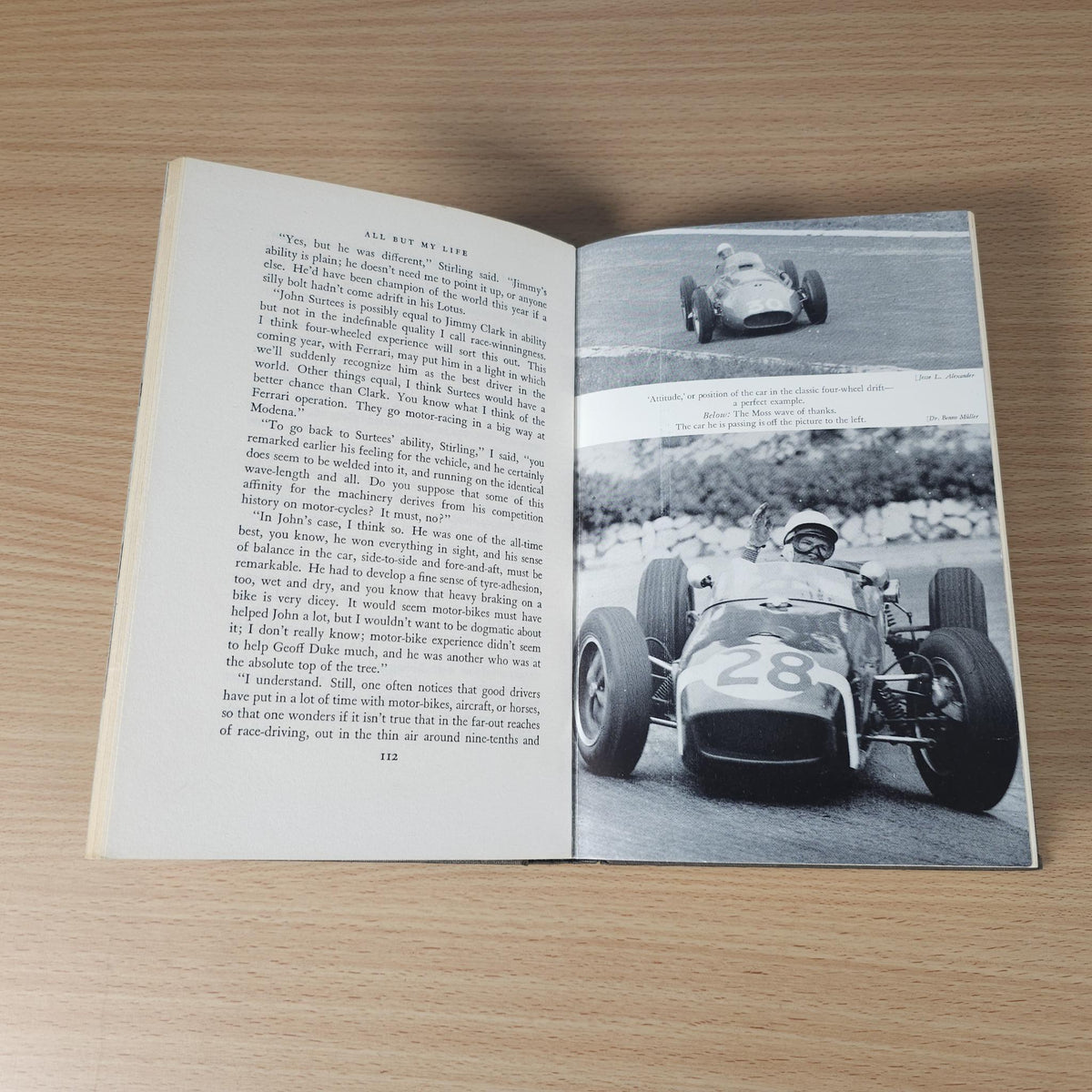 Open book spread with text and black-and-white photos of a race car and driver