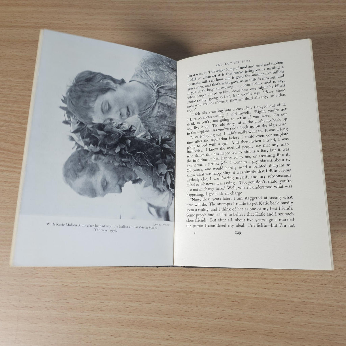 Open book spread with text and a black-and-white photo portrait of a smiling man