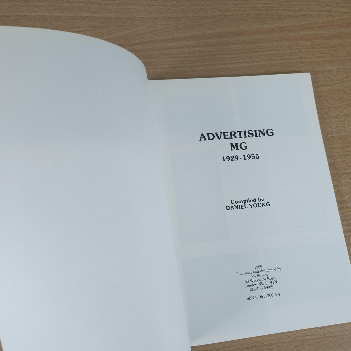 Vintage book with title page reading “Advertising MG 1929–1955” and “Compiled by Daniel Young.”