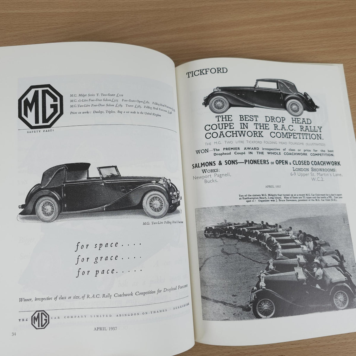 Vintage MG advertising book open to pages with MG car illustration and TICKFORD notice.
