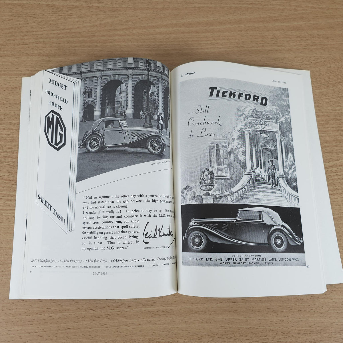 Vintage MG advertising book open to pages with “TICKFORD” and MG drophead coupe photos.