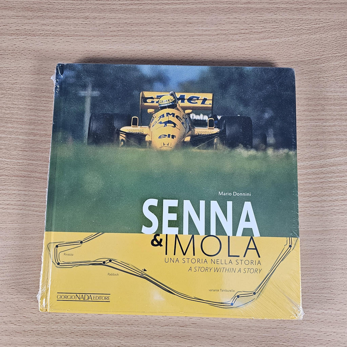 Book front cover with Senna & Imola title and racing car graphic