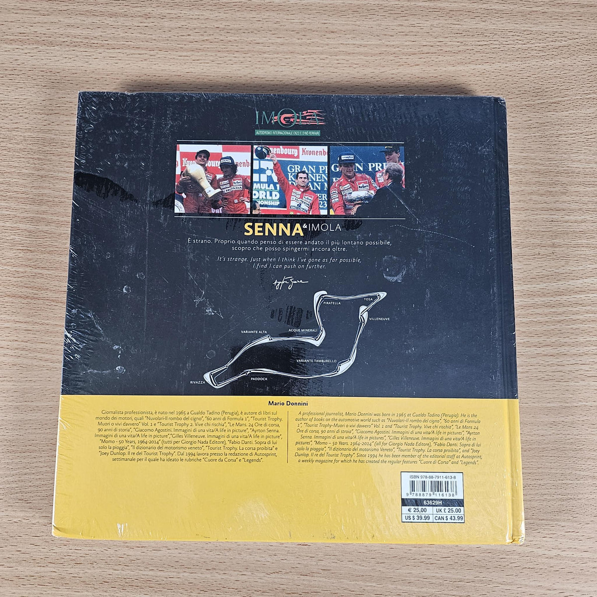 Book back cover with racing car photos, track diagram, and barcode label