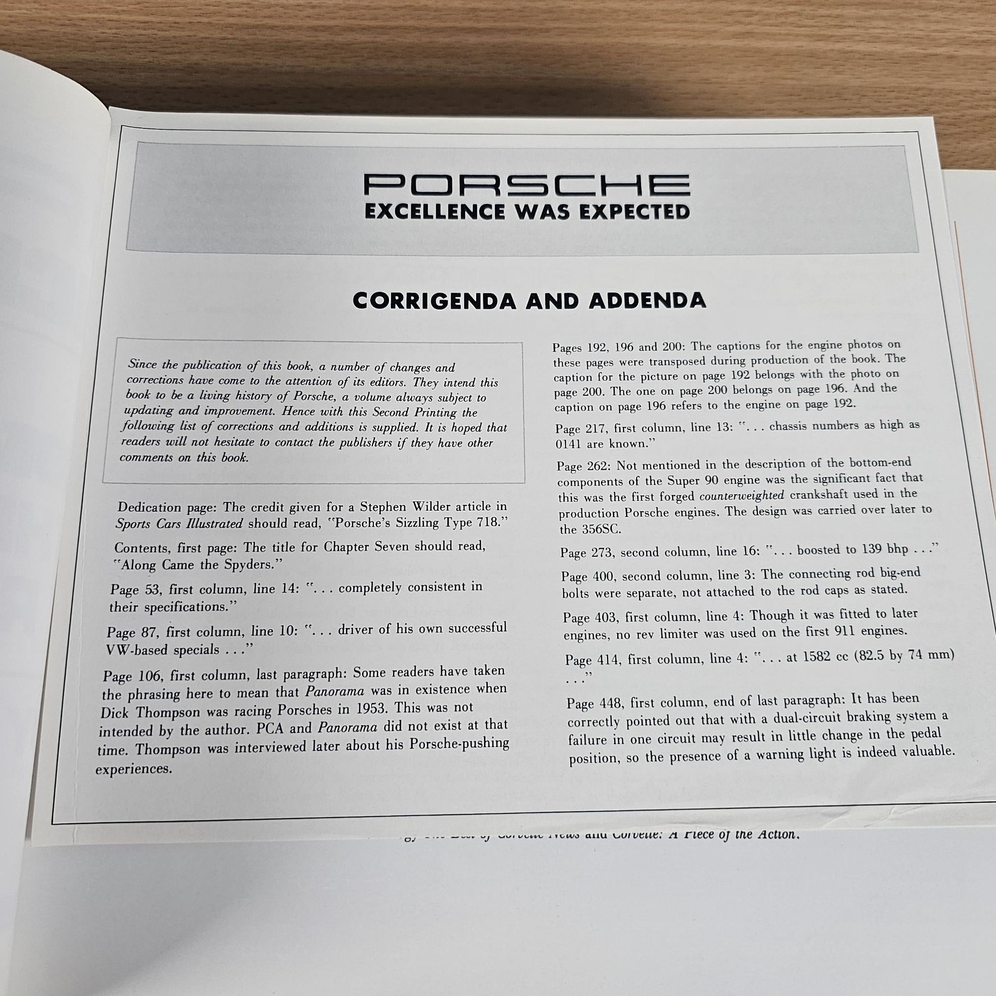 Automobile history book spread titled "CORRIGENDA AND ADDENDA" with paragraphs