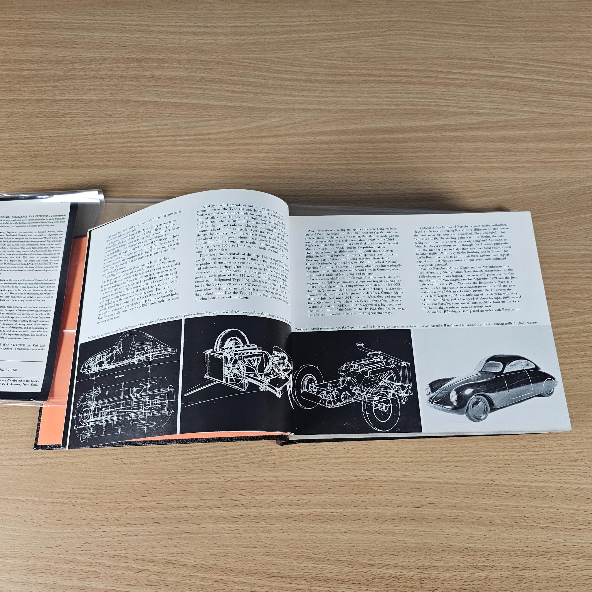 Automobile history book open with technical diagrams and vintage car images