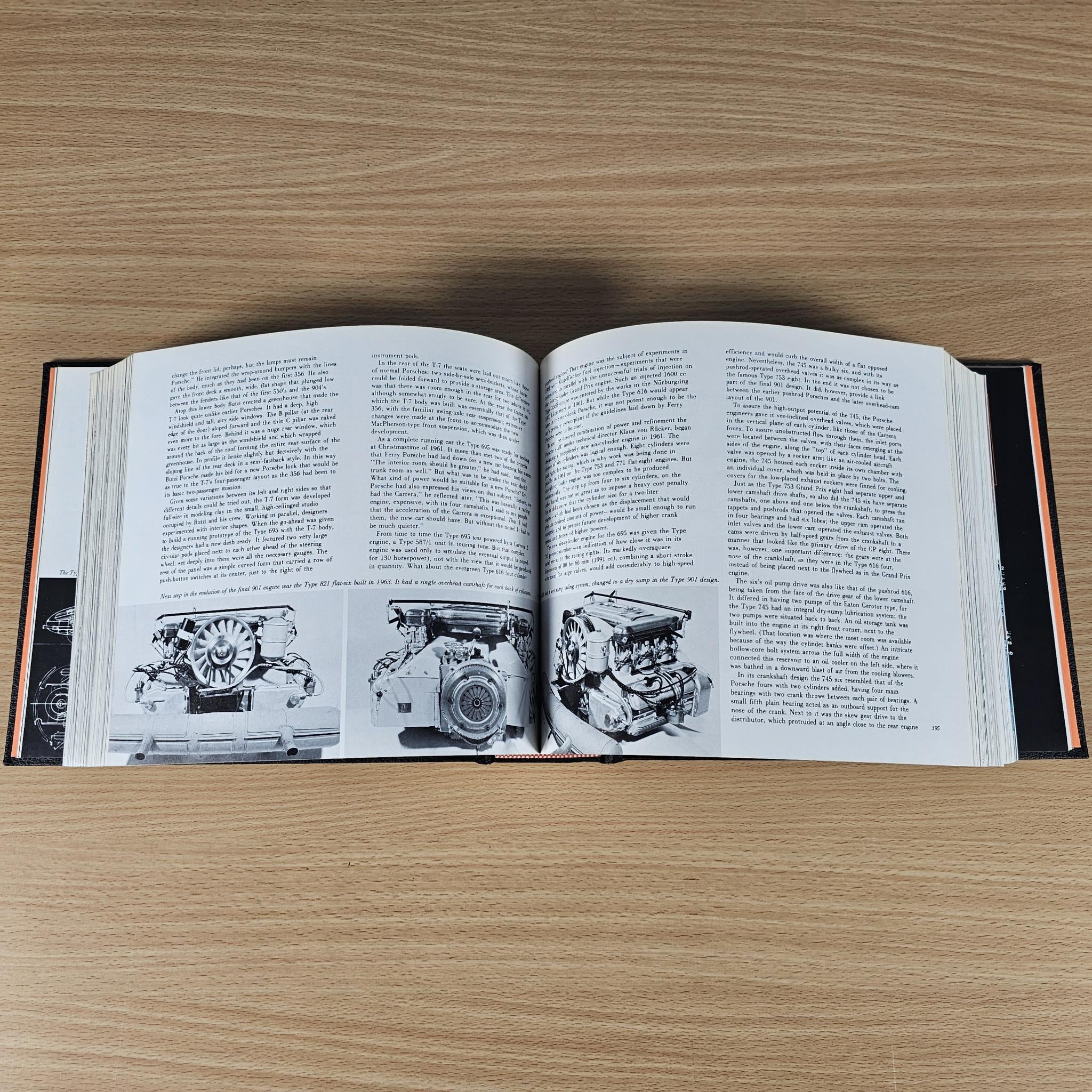 Open book spread with black-and-white engine diagrams and printed text pages.