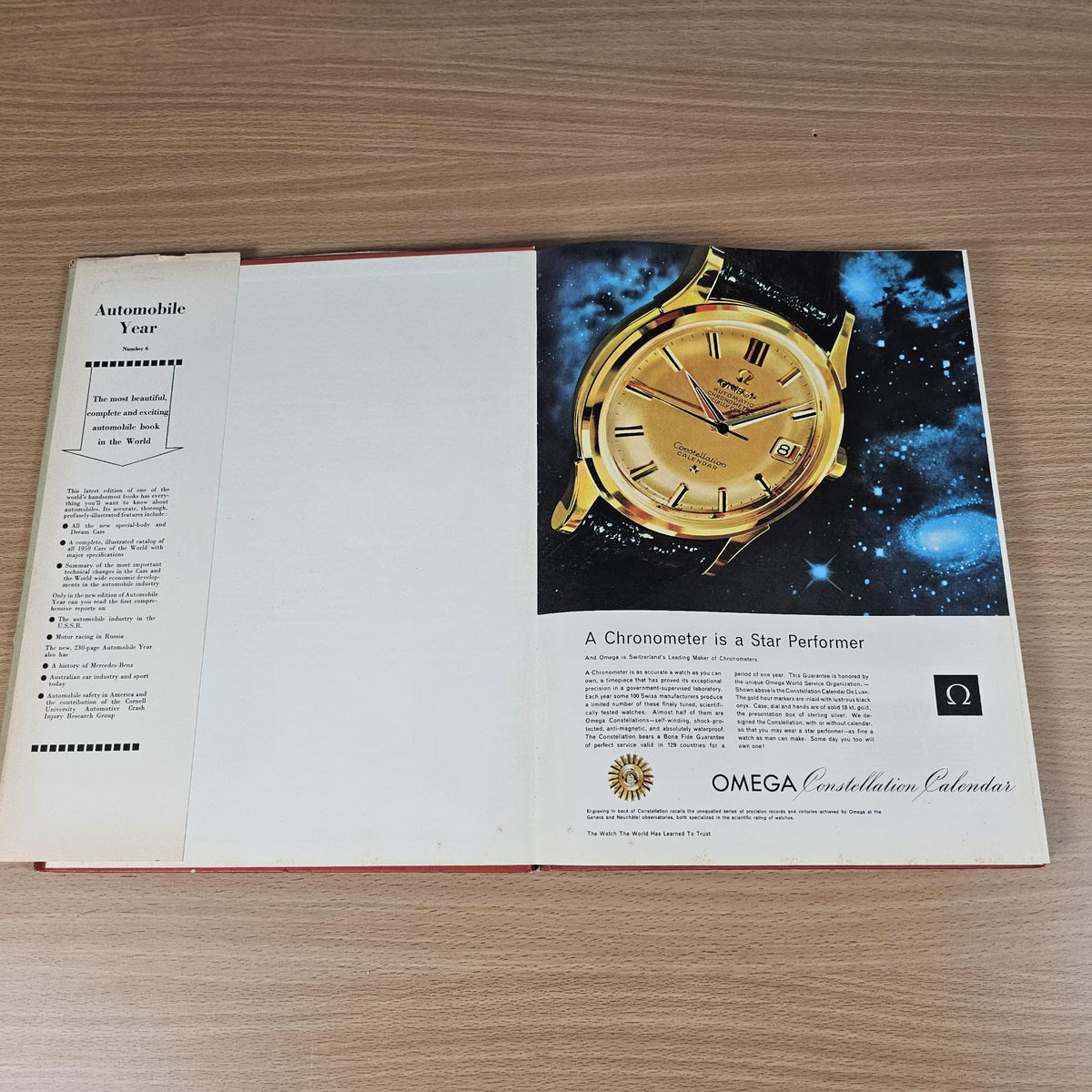 Automobile Year 1958-1959 booklet open to pages with watch ad and timer image