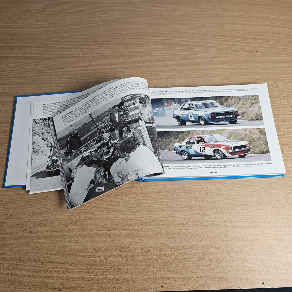 Open book pages with black-and-white race photo and color car photo blocks