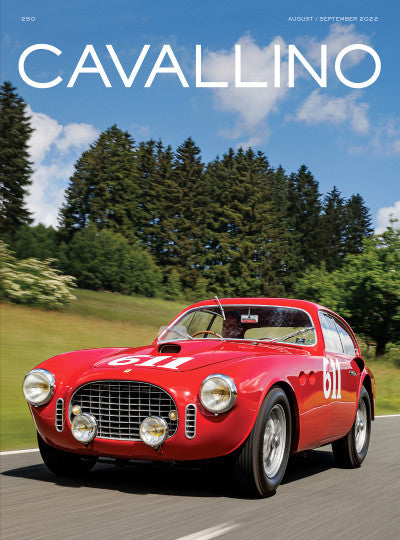 Automotive history magazine cover with red classic Ferrari-style sports car