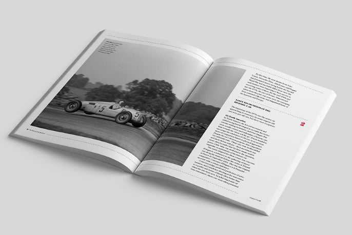 Open historic cars book showing car photo on left and paragraphs on right