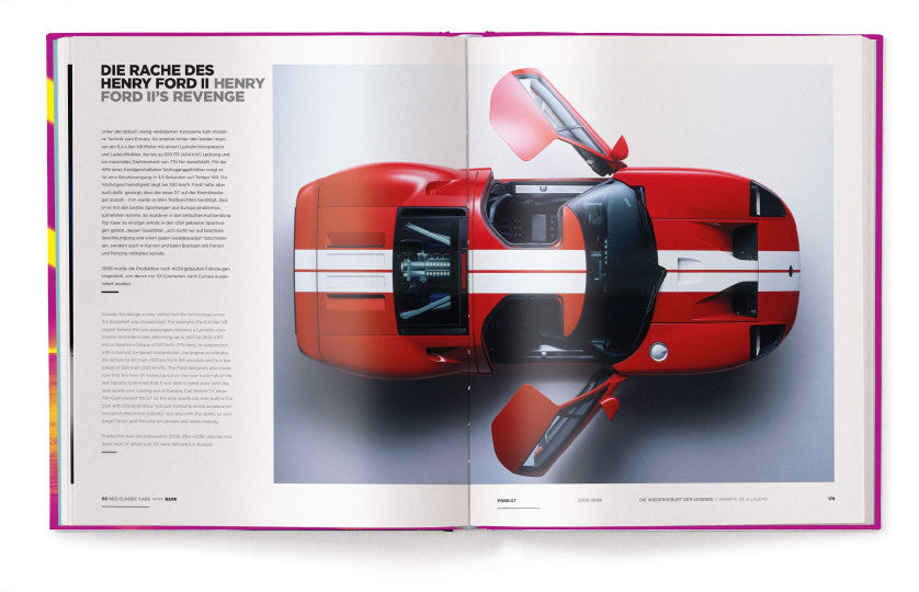 Open automotive book with a red cutaway model of a racing car