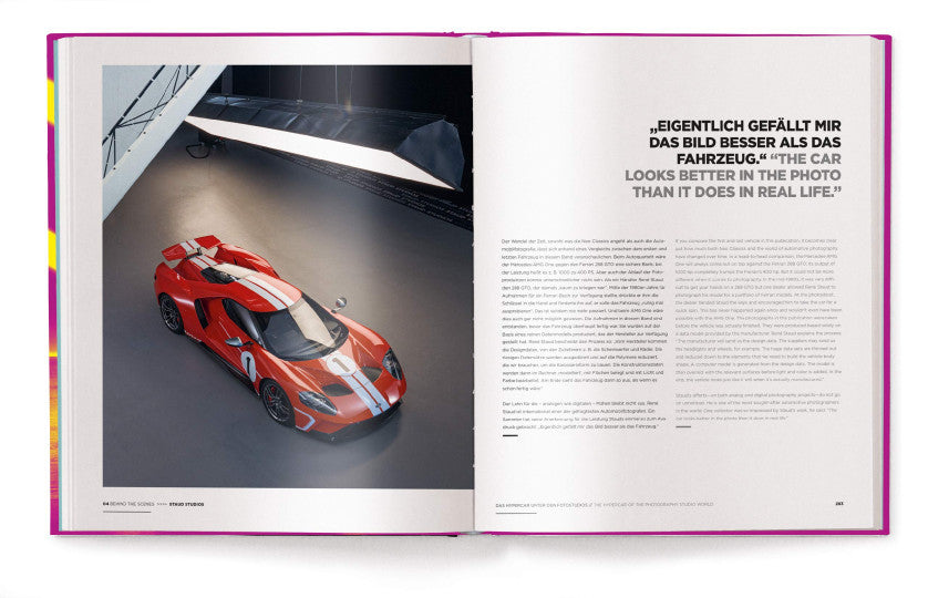 Open automotive book with a red sports car photo on the left page