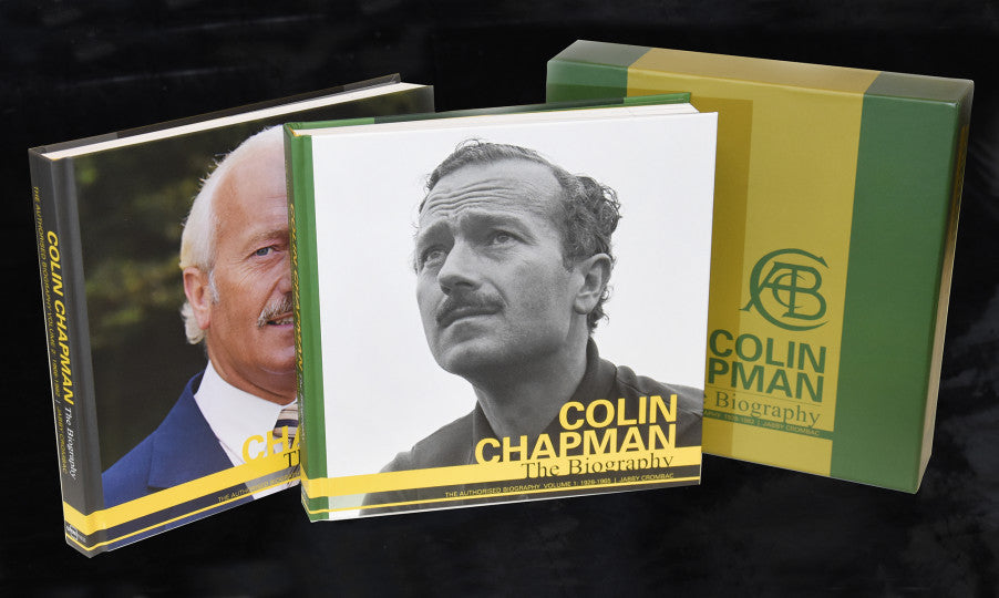 Stack of biography books with green, yellow, and portrait covers, Colin Chapman branding