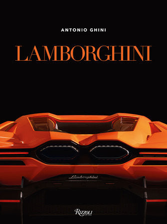 Orange Lamborghini sports car front view with black grille and dual circular lights