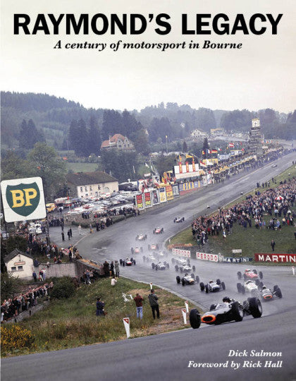 Motorsport history book with cover photo of racing cars on a track