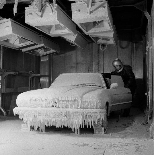 Mercedes-Benz SL & SLC book page showing a white car body in a workshop