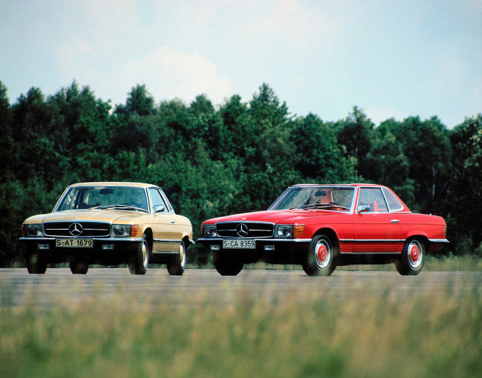 Mercedes-Benz SL & SLC book page showing two classic cars parked outdoors