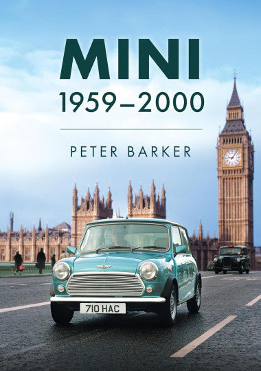 Classic green Mini car, front view with chrome grille and headlights