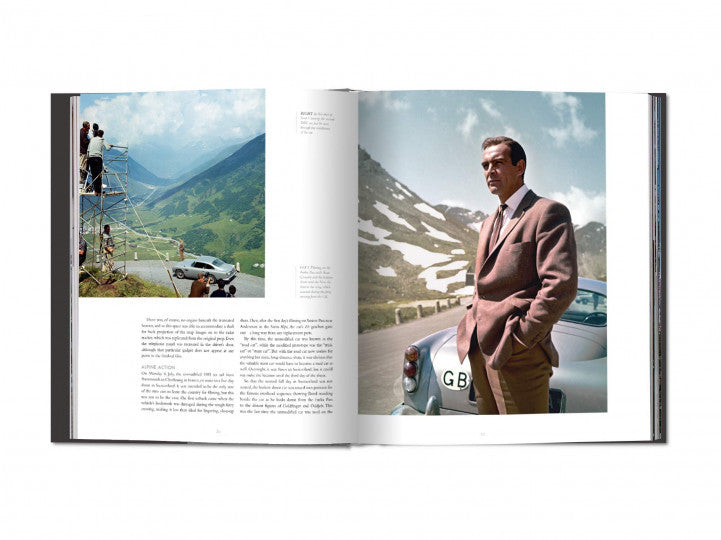 Open hardcover book with photos of a suited man and a vintage car