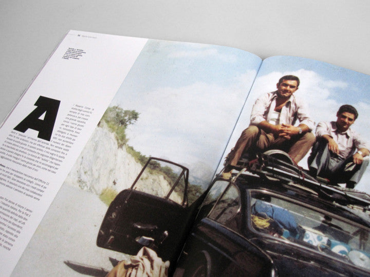 Automotive history book, open pages with vintage car photo and large letter A