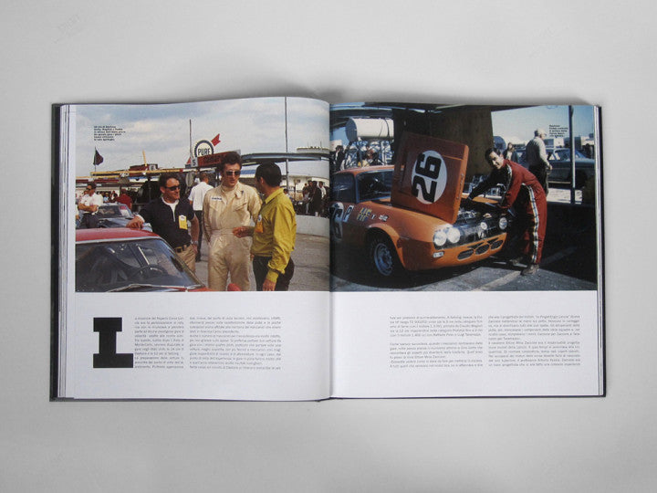 Automotive history book, open spread with color photos of race cars and people