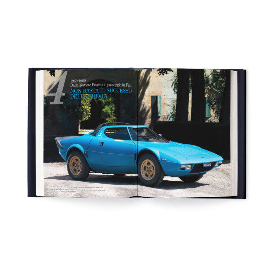 Open book spread with blue classic coupe car photo and printed story text
