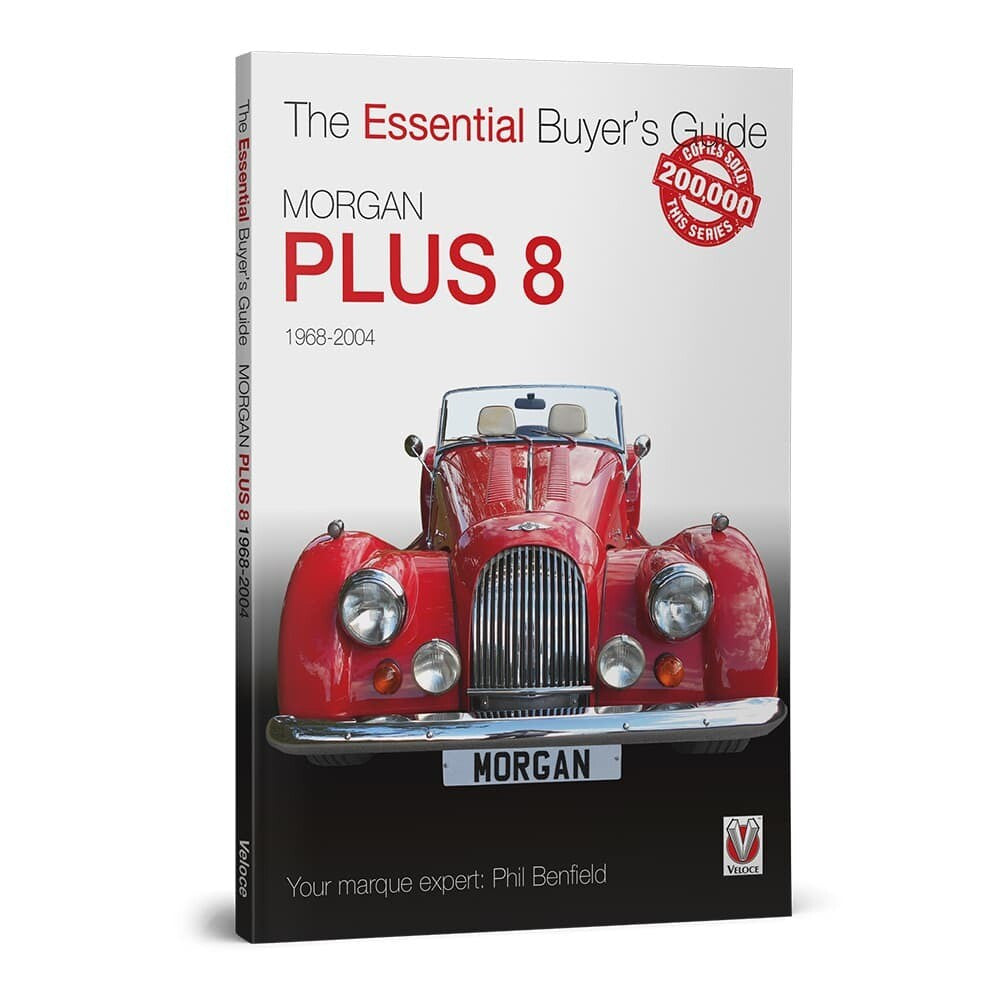 Automotive buyer's guide book shown in full with red classic car on cover.