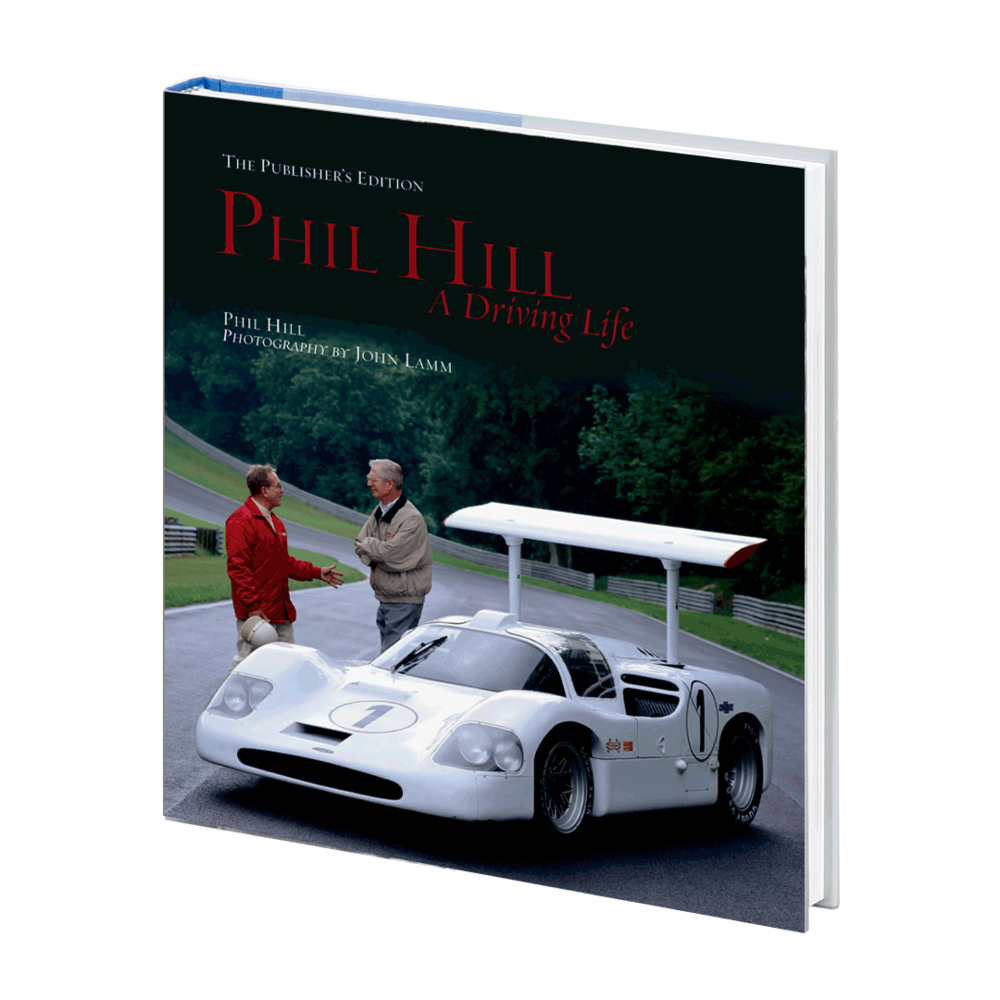 Collector hardcover book with dark green cover and race car photo