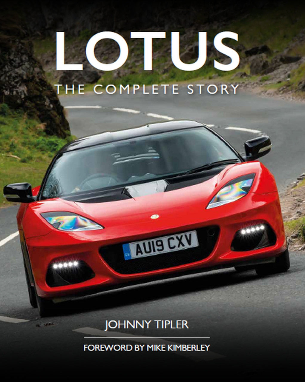 Book front cover close-up with red sports car front view and "LOTUS THE COMPLETE STORY" title