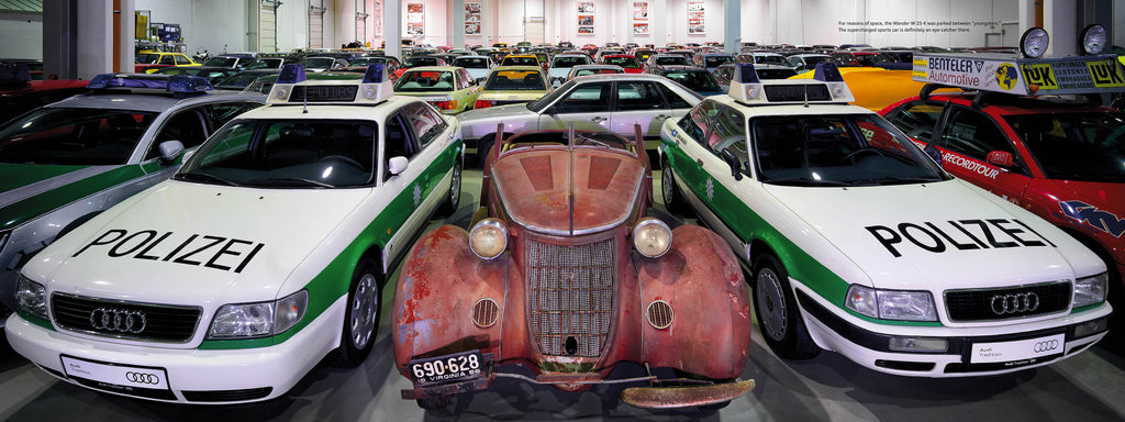 Three classic police cars with green stripes and front hood view