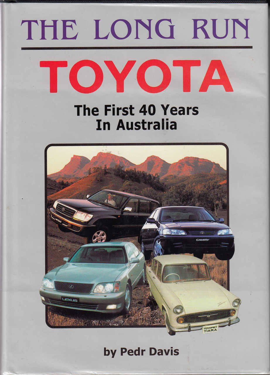 Automobile history book front cover with Toyota title and vintage car lineup